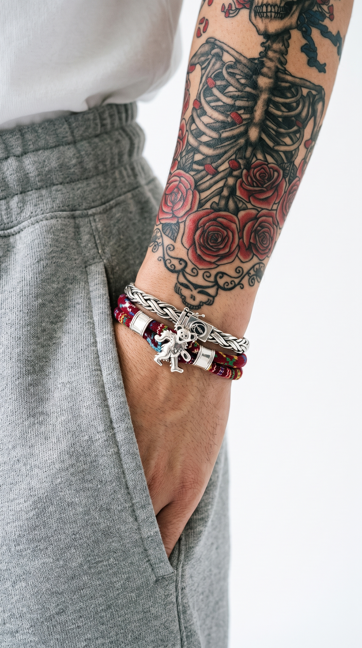 Grateful Dead Official Licensed Collection - sterling silver braided bracelet and Dancing Bear beaded bracelet on a tattooed wrist (mobile)