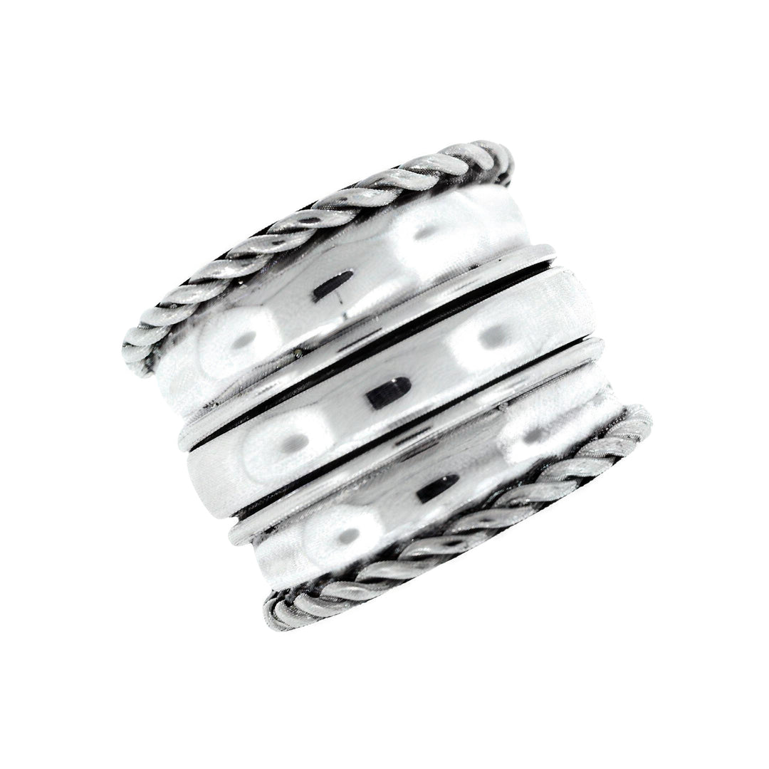 Nusantara Flores sterling silver spinner ring with twisted rope edges and hammered bands - Cynthia Gale New York
